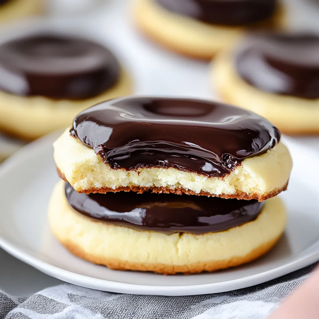 Soft Boston cream pie cookies with a creamy filling and rich chocolate glaze.