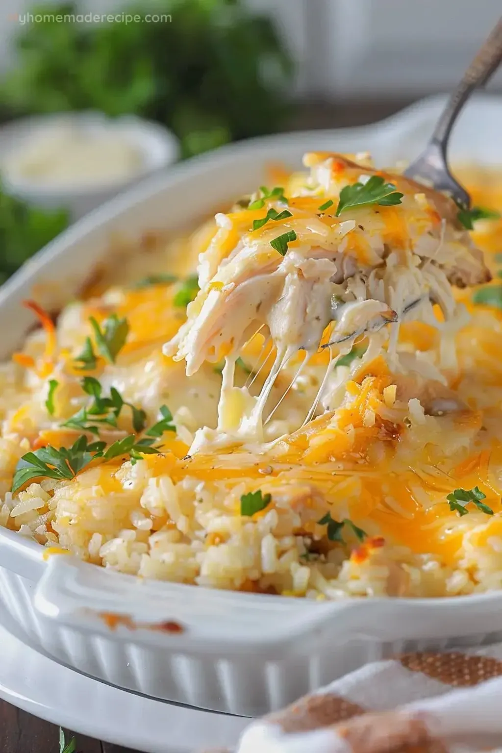 A white bowl of food with a fork in it.