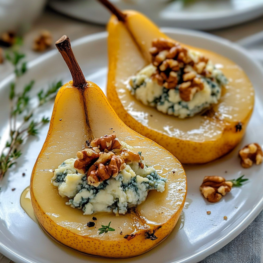 A plate of two pears with a blue cheese topping, garnished with walnuts.