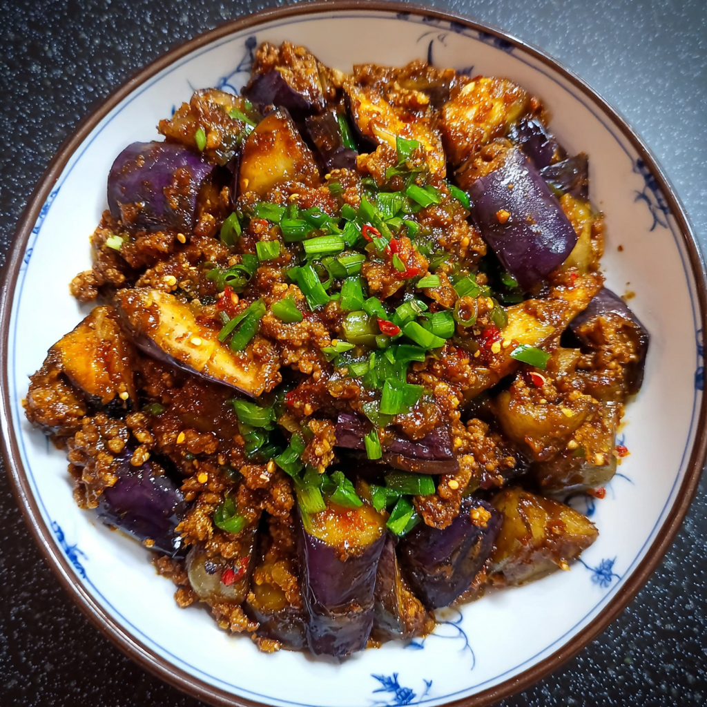 A bowl of Spicy Sichuan Eggplant filled with various ingredients.