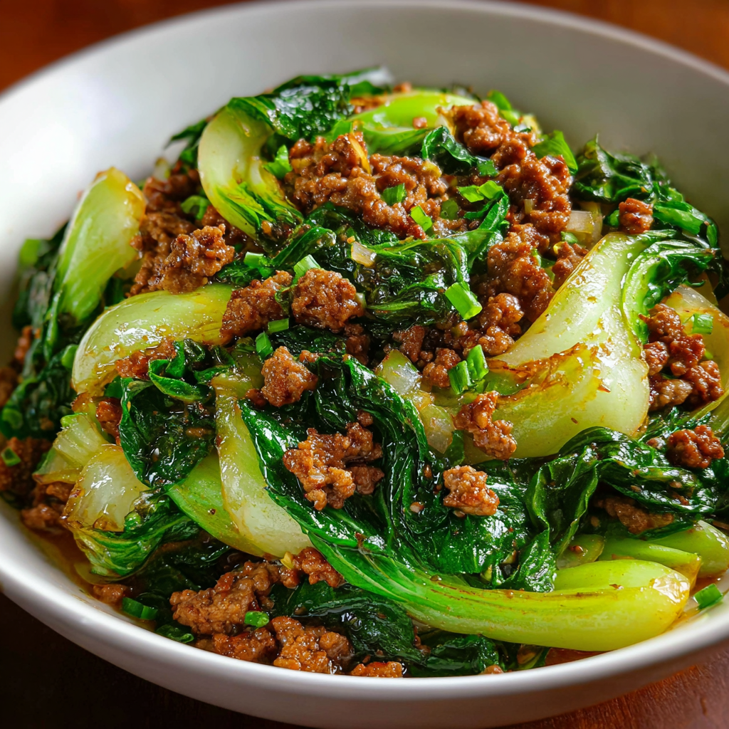 A bowl of beef and broccoli stir fry, ready to be eaten.