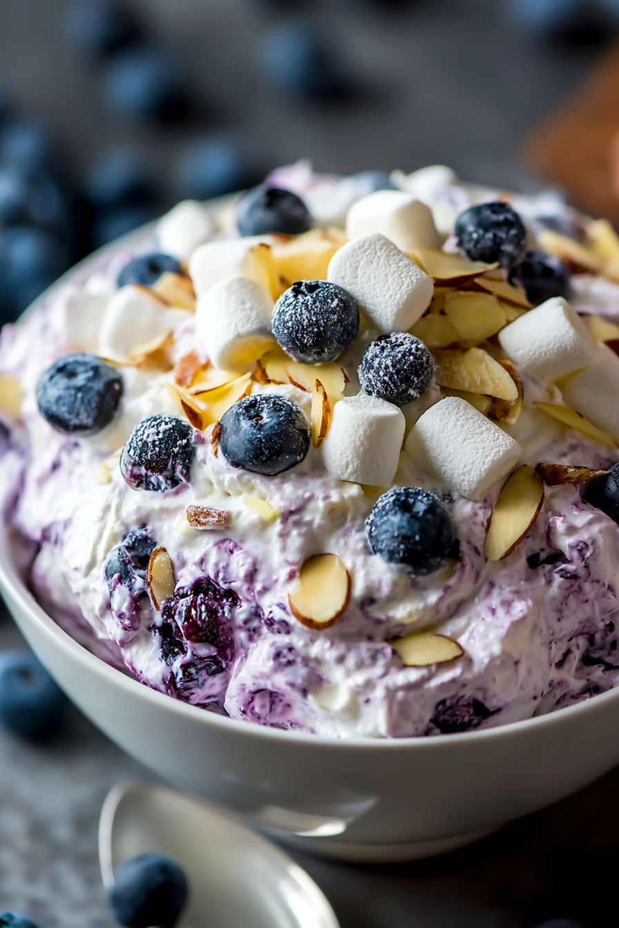 A bowl of blueberry and almond cream.
