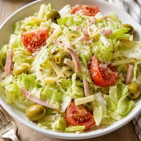 1905 Salad with ham, Swiss cheese, olives, tomato, and Romano