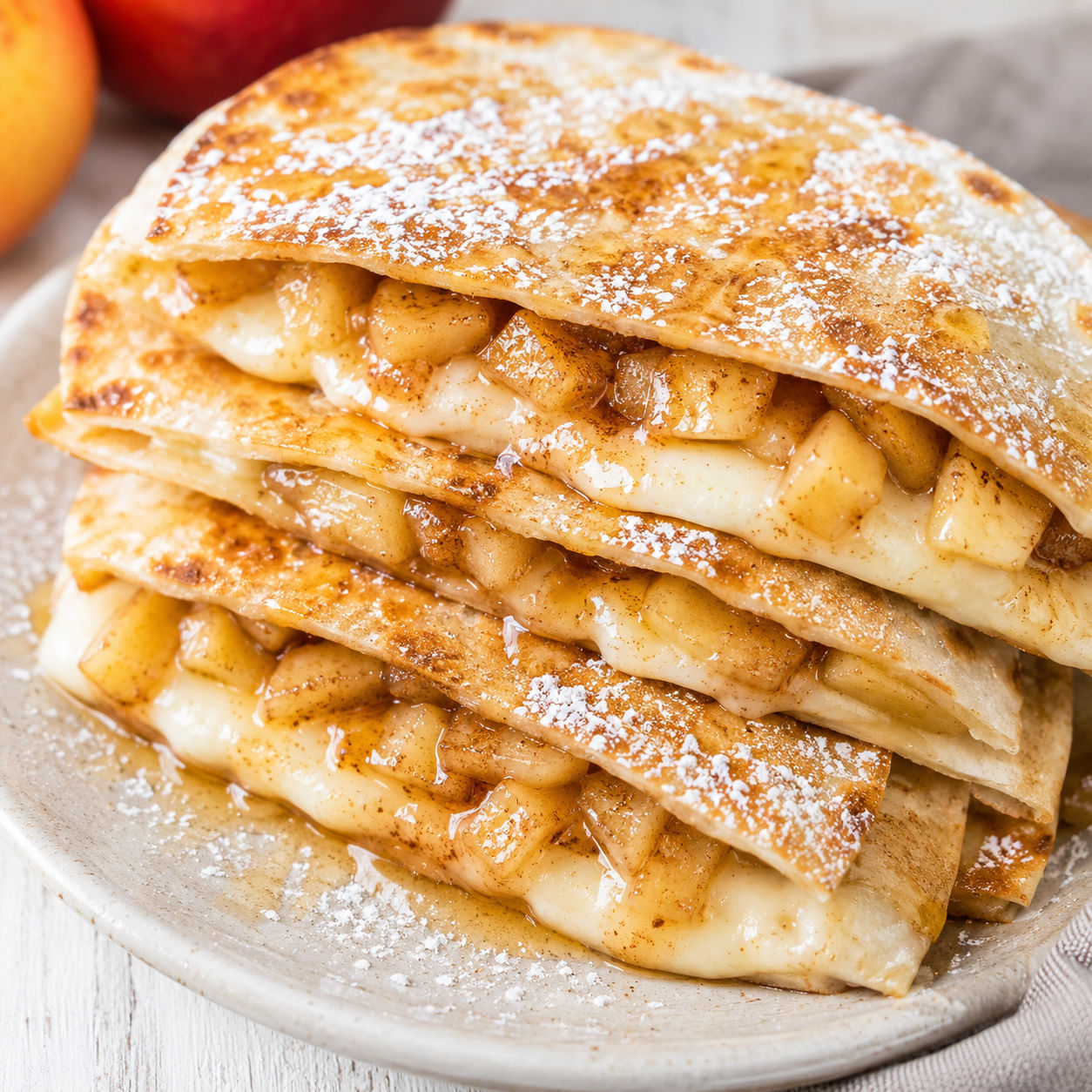 Apple cinnamon breakfast quesadilla wedges with cream cheese filling