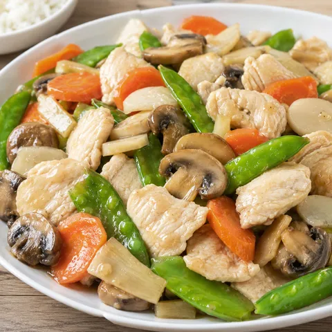 Moo goo gai pan with chicken, mushrooms, snow peas, and carrots