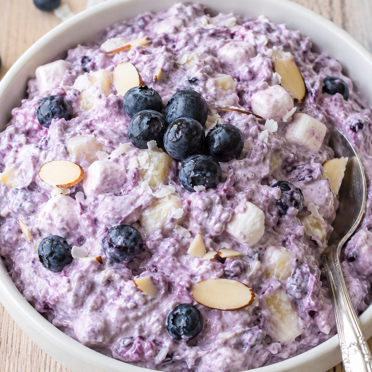 Blueberry fluff salad with pineapple, marshmallows, almonds, and blueberries