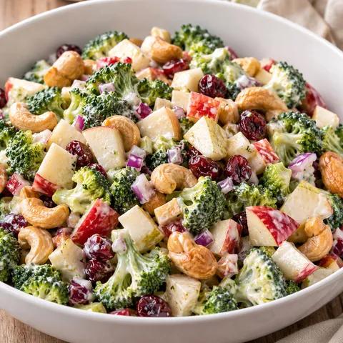 Broccoli cashew salad with diced apples, pears and cranberries in a creamy dressing