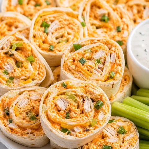 Buffalo chicken pinwheels with green onions and ranch dip