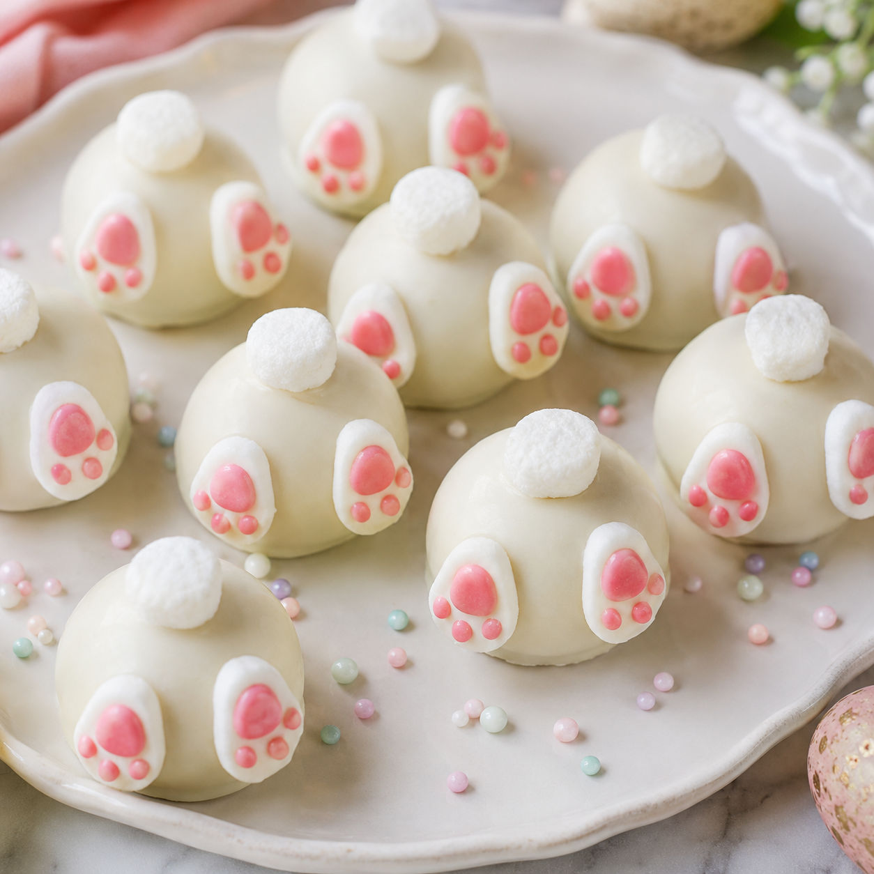 Bunny Butt Oreo Balls with marshmallow tails and pink candy feet