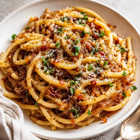 Caramelized onion pasta with chilli oil, parmesan, and parsley
