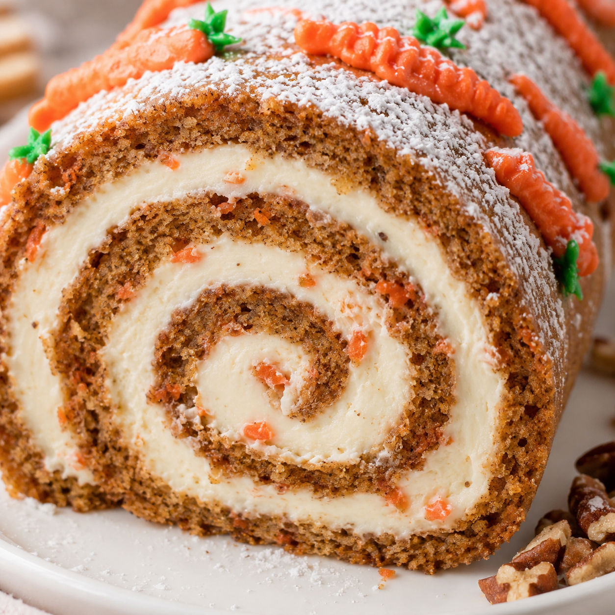 Carrot cake roll with cream cheese filling and powdered sugar