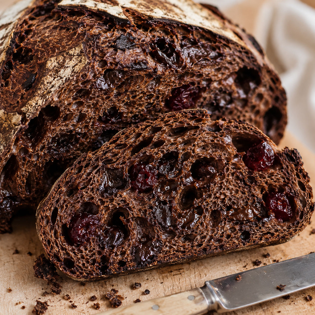 Chocolate cherry sourdough bread with dark crumb and cherry pieces