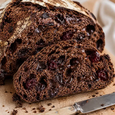 Chocolate cherry sourdough bread with dark crumb and cherry pieces