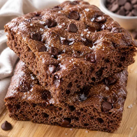 Chocolate sourdough focaccia squares with chocolate chips and flaky salt