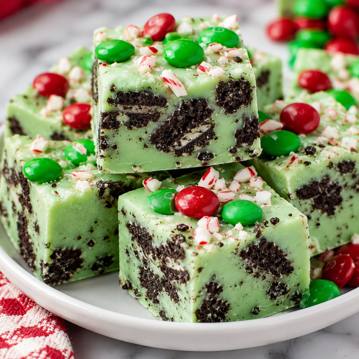 Christmas Mint Oreo Fudge squares with red and green candy topping