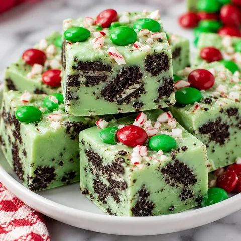 Christmas Mint Oreo Fudge squares with red and green candy topping