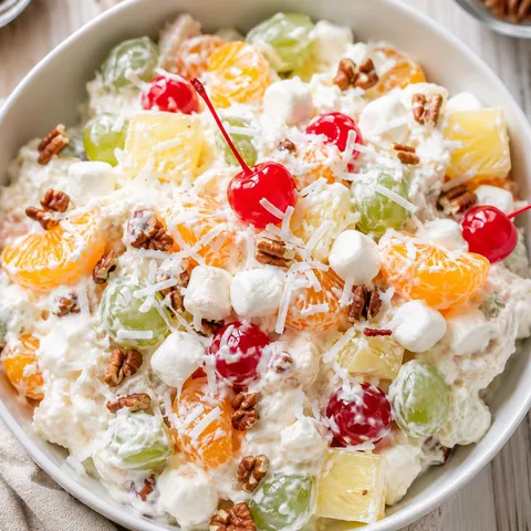 Ambrosia fruit salad with coconut, cherries, mandarins, and marshmallows