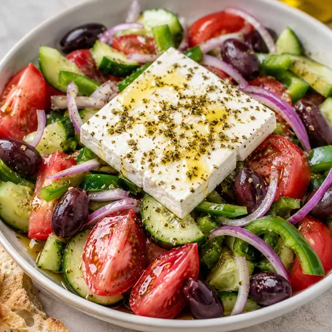Classic Greek Salad with feta, tomatoes, cucumber, olives, and oregano