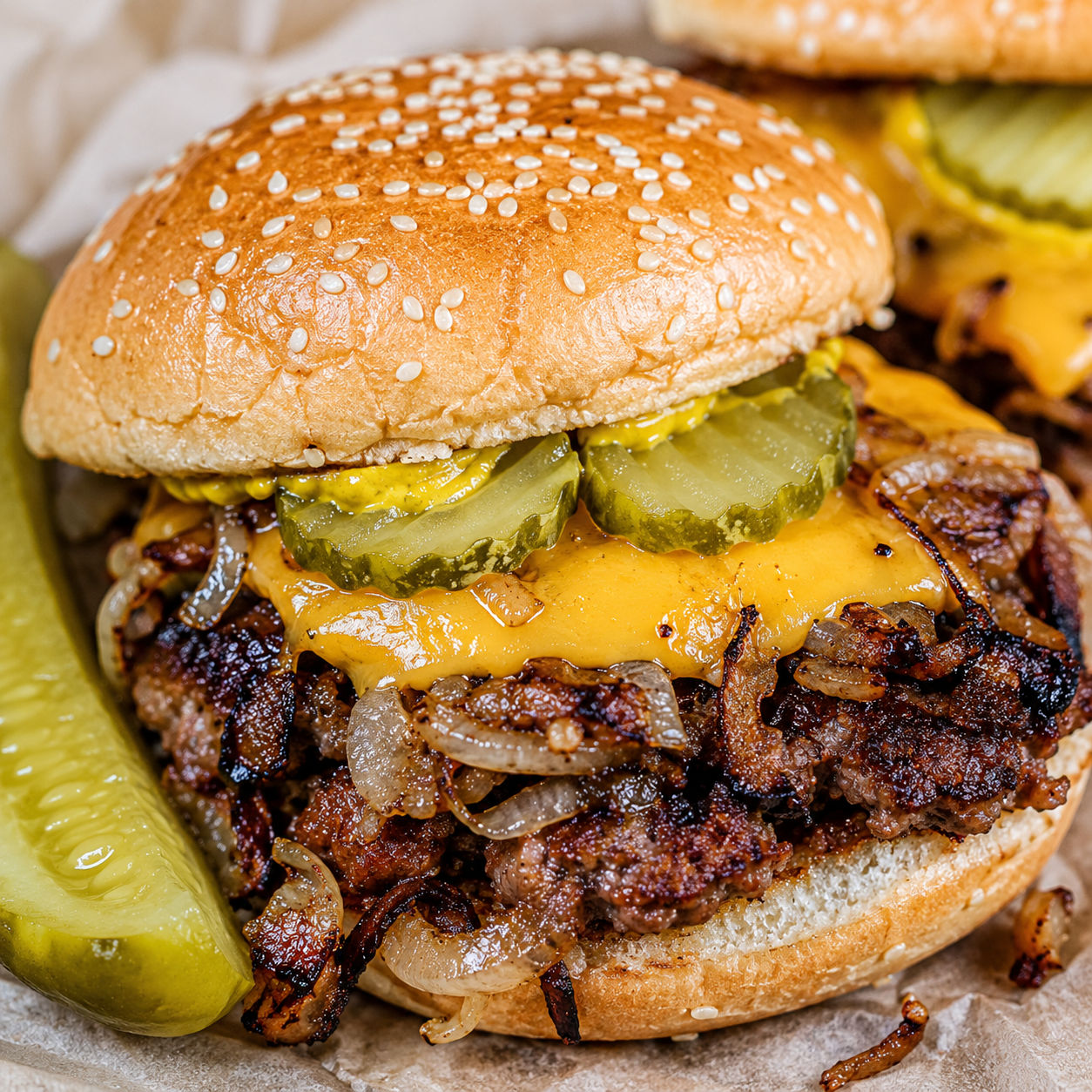 Oklahoma fried onion burger with melted cheese, mustard, and pickles
