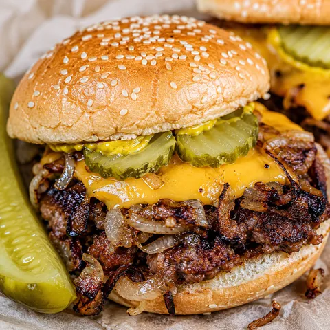 Oklahoma fried onion burger with melted cheese, mustard, and pickles