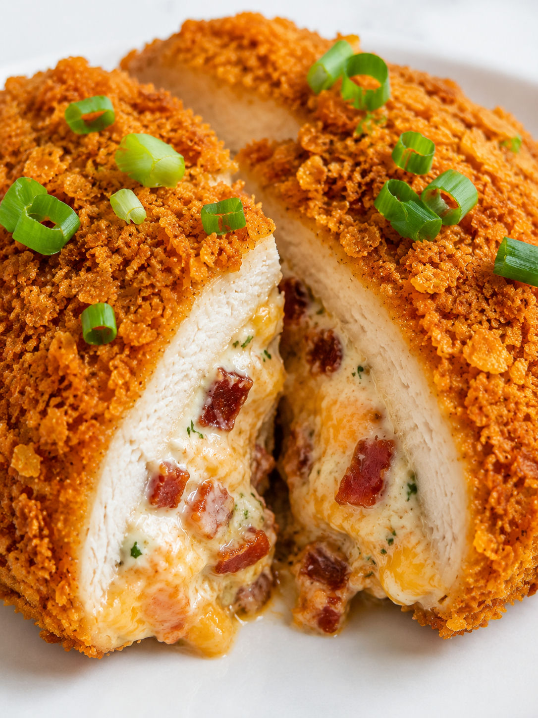 Sliced Doritos chicken with creamy bacon cheddar filling and scallions