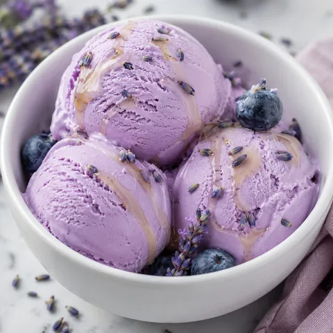 Creamy lavender ice cream with honey drizzle and lavender buds
