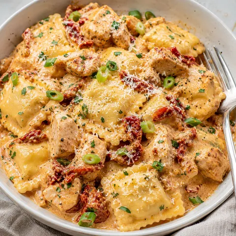 Creamy sun-dried tomato chicken ravioli with Parmesan and parsley