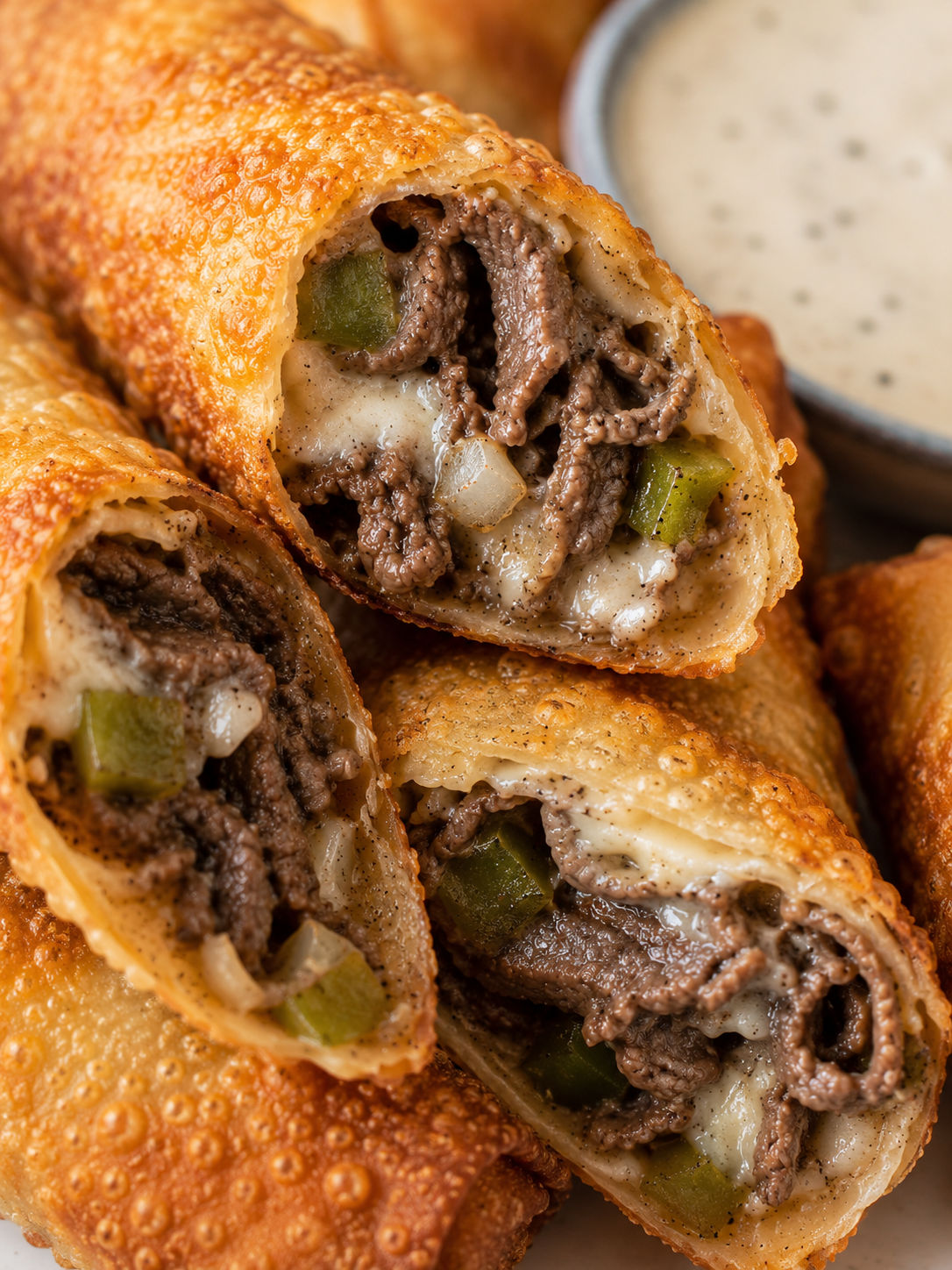 Crispy Philly Cheesesteak Egg Rolls, plated and served