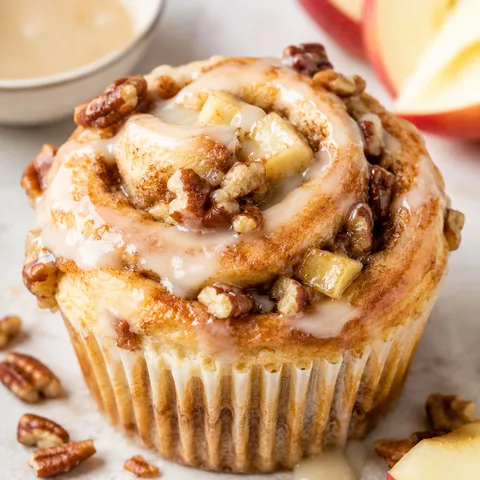 Apple cinnamon roll cupcakes with cider glaze and pecans