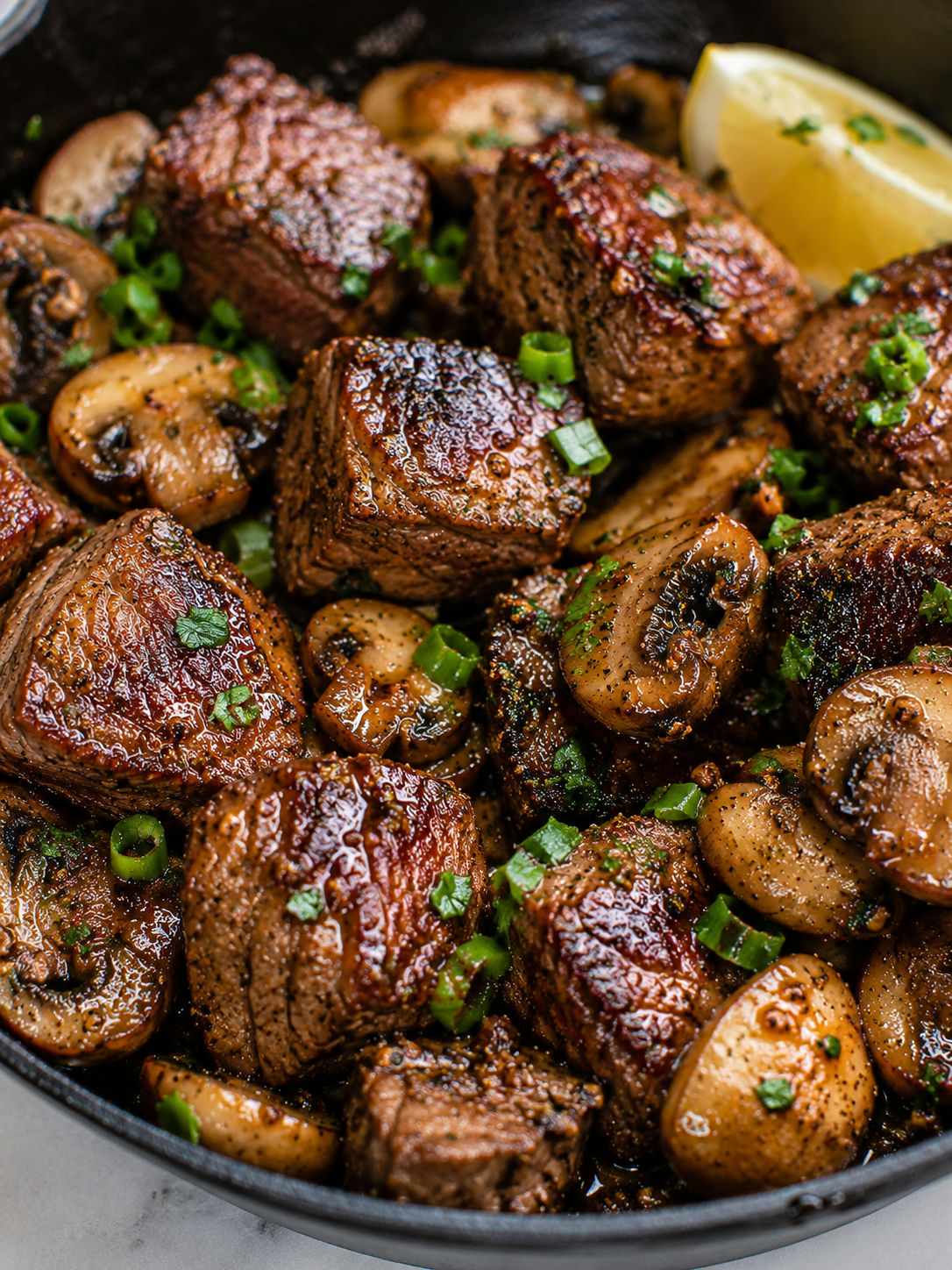 Delicious Cajun Butter Steak Bites with Mushrooms, plated and served