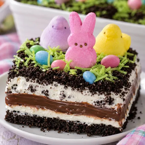 Easter dirt cake with Oreo crumbs, candy eggs, and marshmallow bunnies