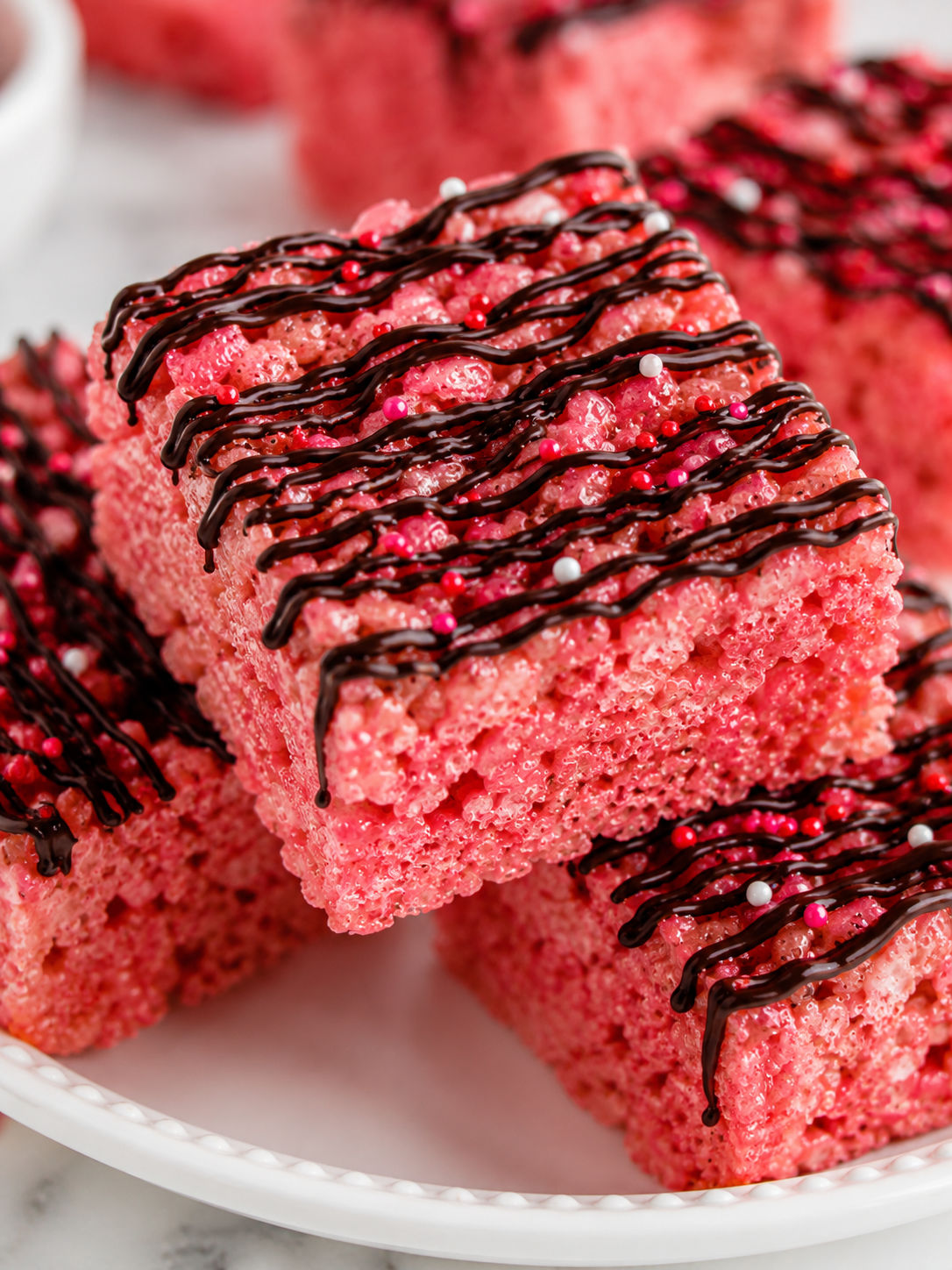 Easy Cherry Rice Krispie Treats with Dark Chocolate Drizzle, plated and served