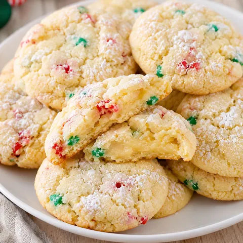 Christmas gooey butter cookies with powdered sugar and red green sprinkles