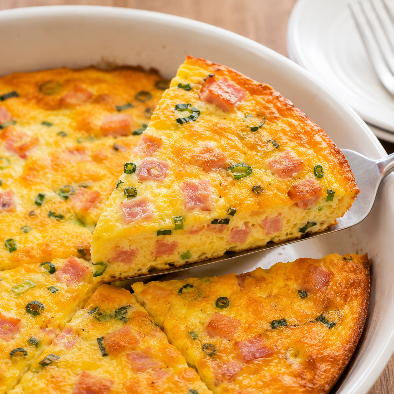 Crustless ham and cheese quiche with cheddar and green onions