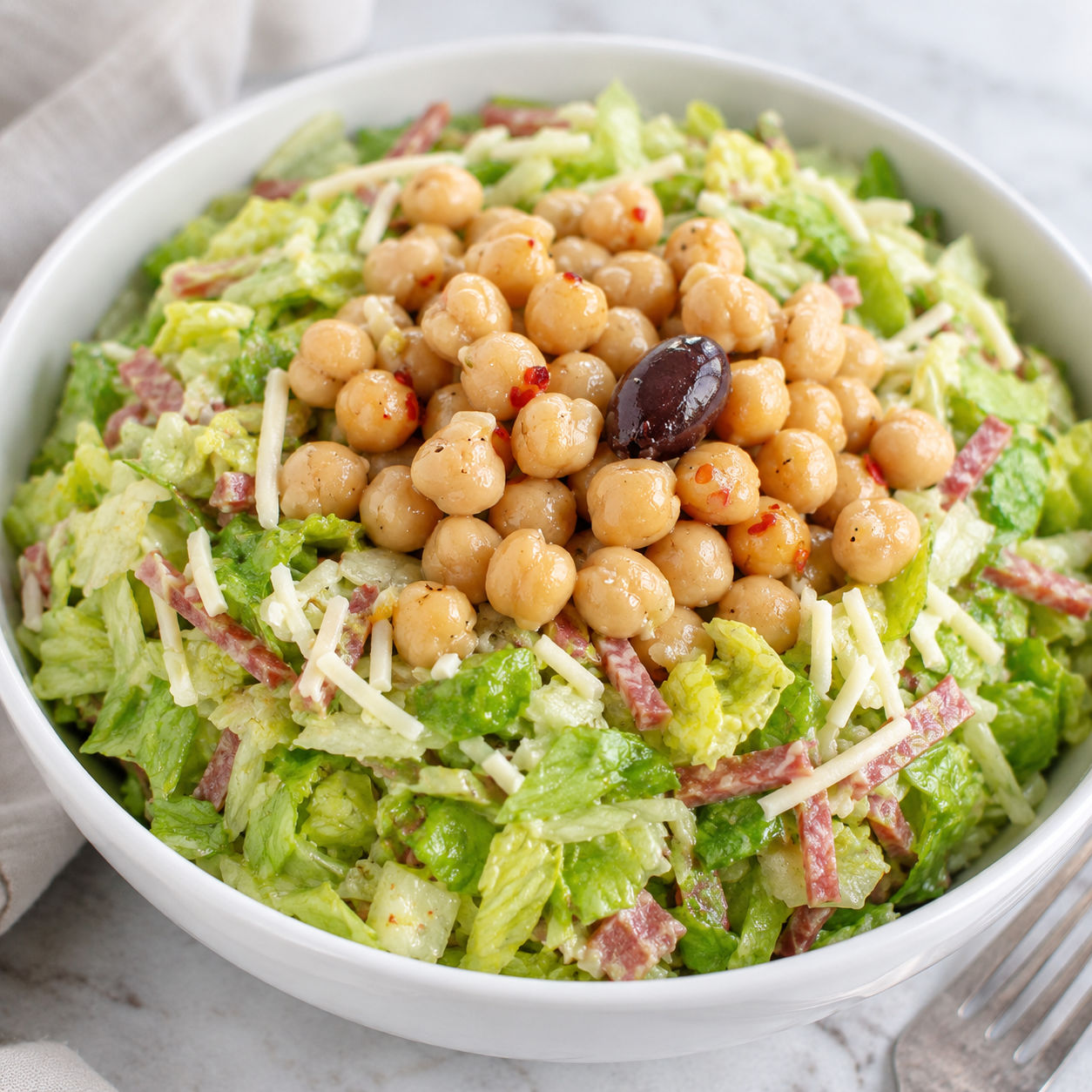 La Scala chopped salad with chickpeas, salami, mozzarella, and olive