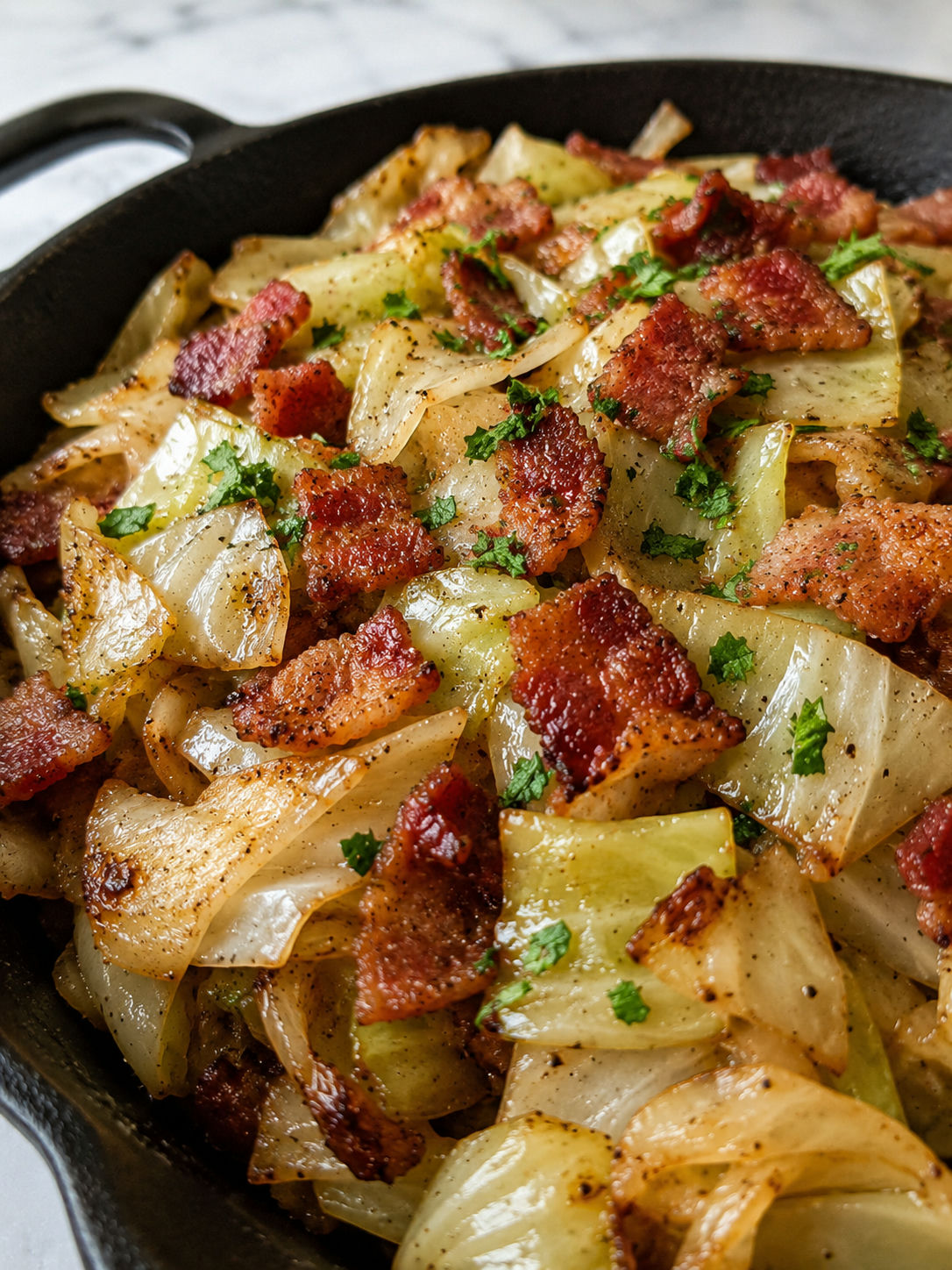Easy Fried Cabbage with Onions and Bacon, plated and served