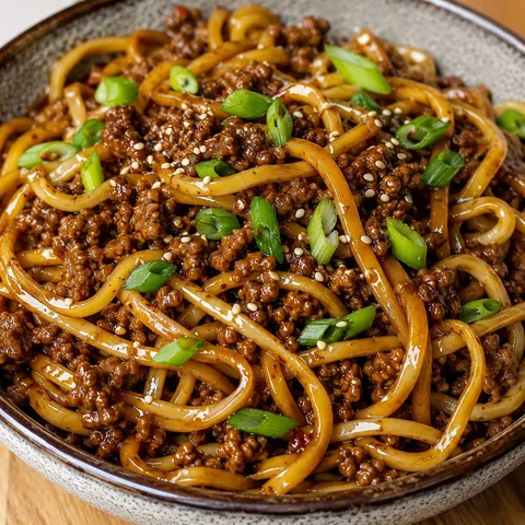 Mongolian ground beef noodles with green onions and sesame seeds