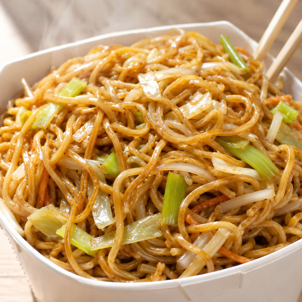 Panda Express copycat chow mein with cabbage and celery in a white bowl