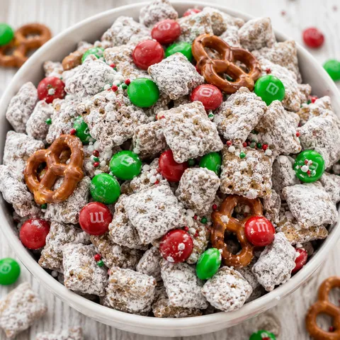 Reindeer chow muddy buddies with pretzels and red and green candies