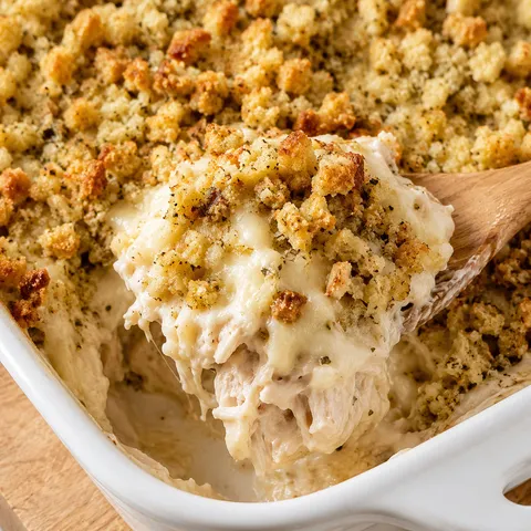 Easy Swiss chicken casserole with golden stuffing topping in a white baking dish