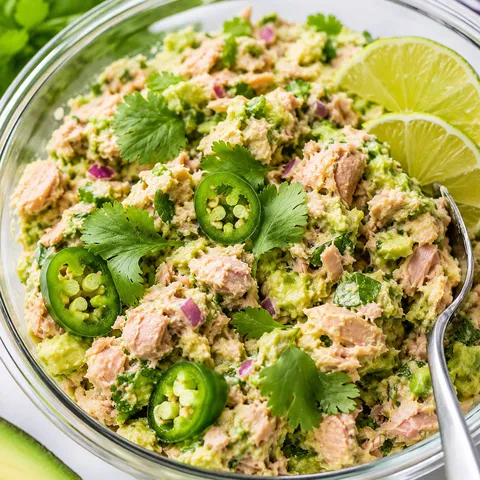 Avocado and tuna mix with lime, cilantro, jalapeno, and red onion