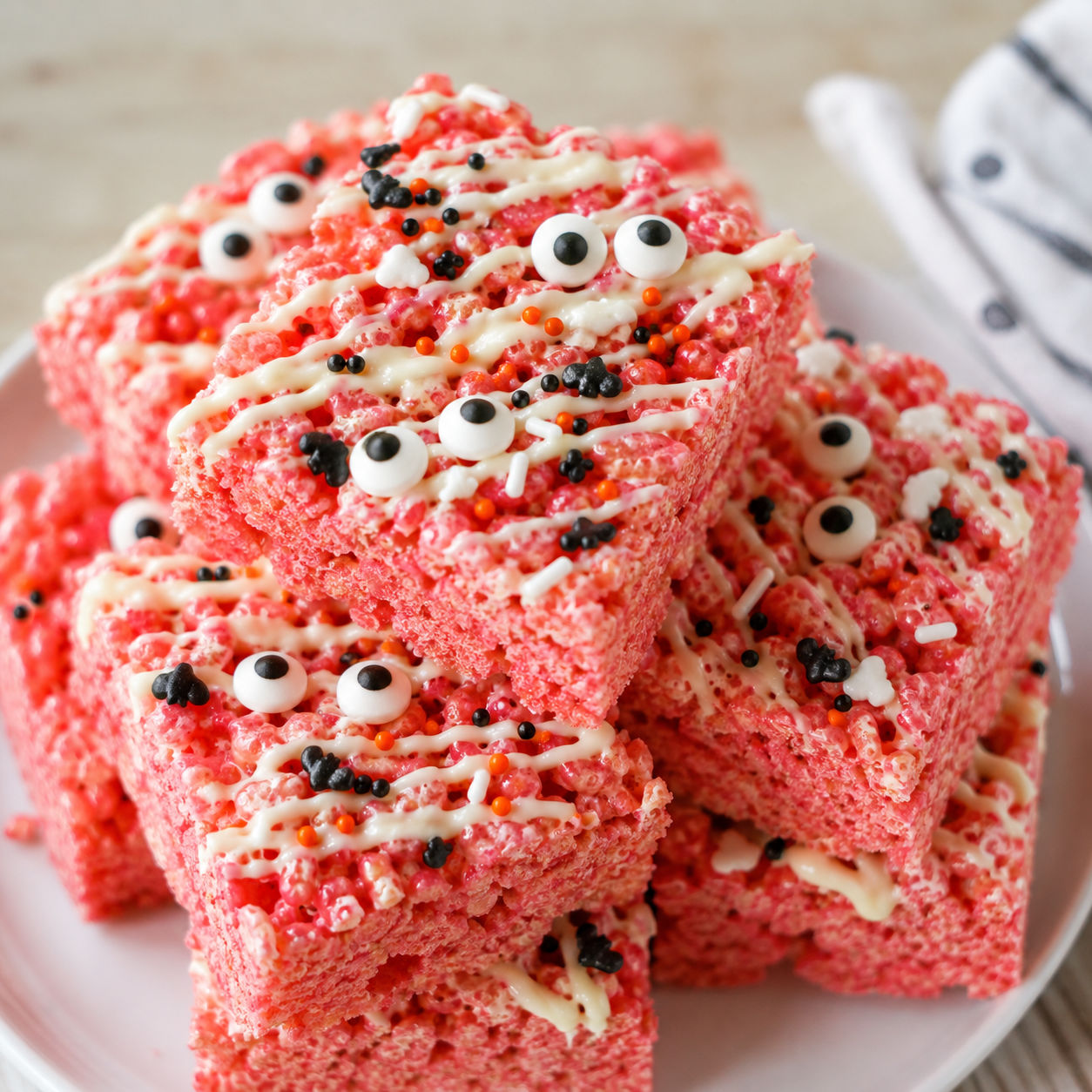 Franken Berry Krispies squares with white chocolate drizzle and candy eyes