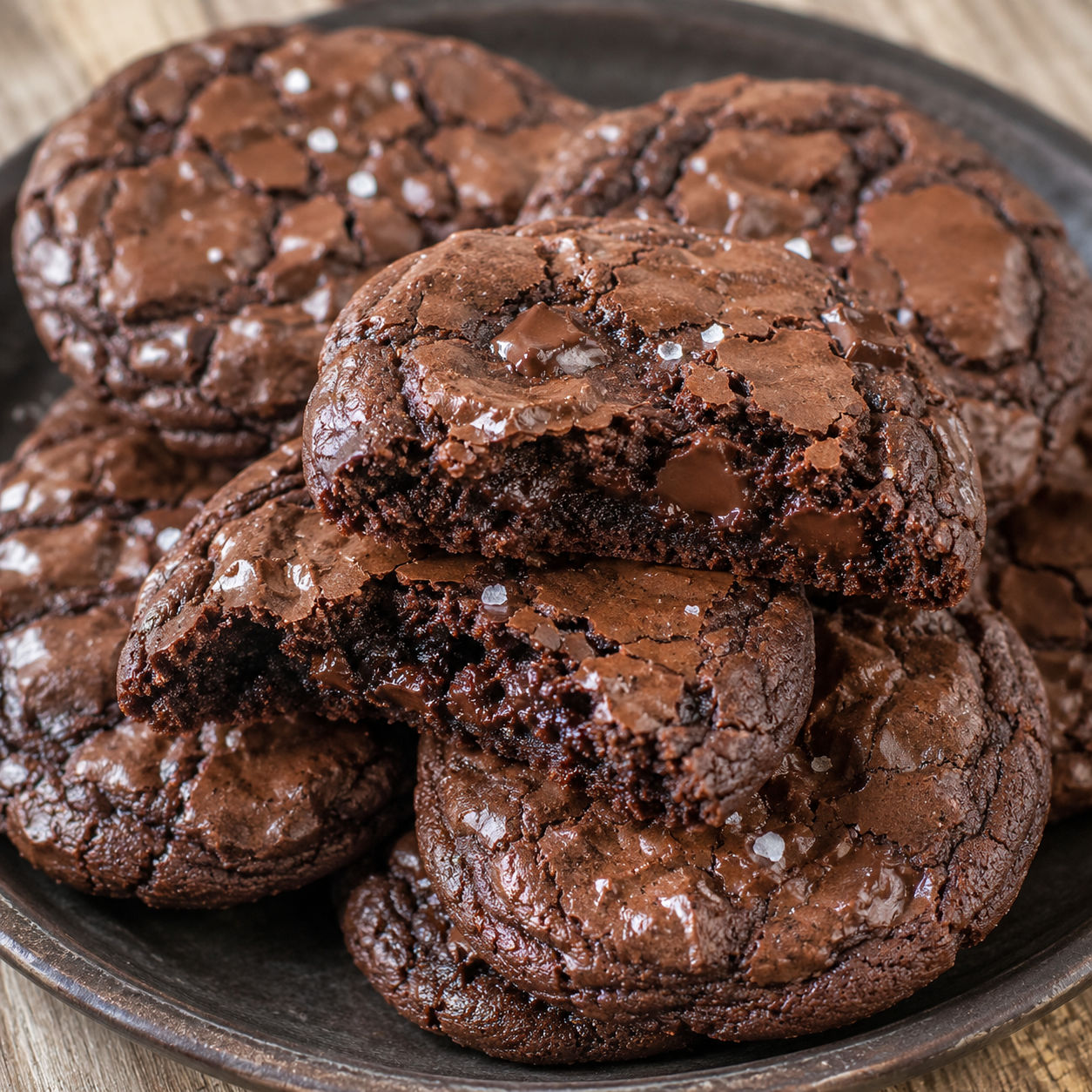 Fudgy brownie cookies with crackly tops and a broken soft center