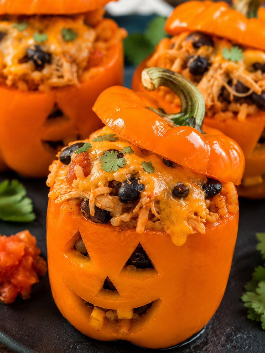 Halloween Shredded Chicken & Rice Stuffed Peppers, plated and served