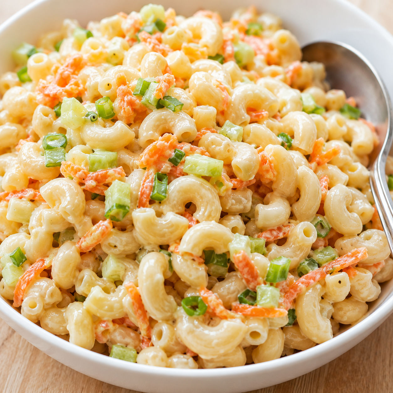 Creamy Hawaiian BBQ macaroni salad with carrot and green onion