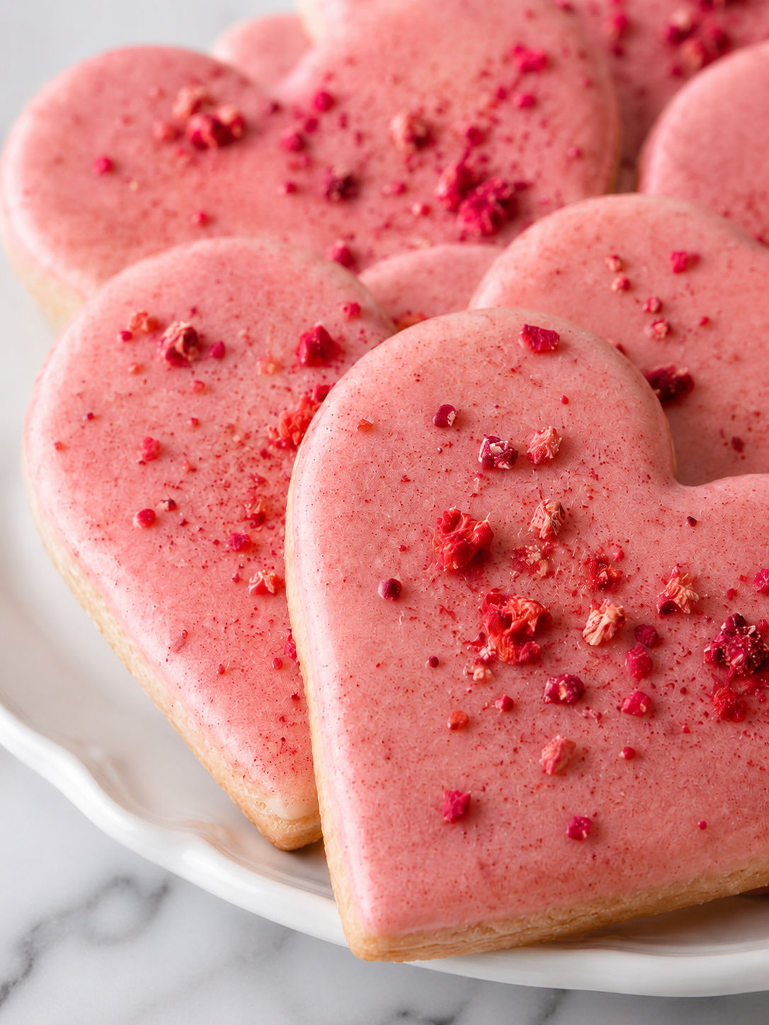 Heart-shaped Strawberry Shortbread Cookies, plated and served