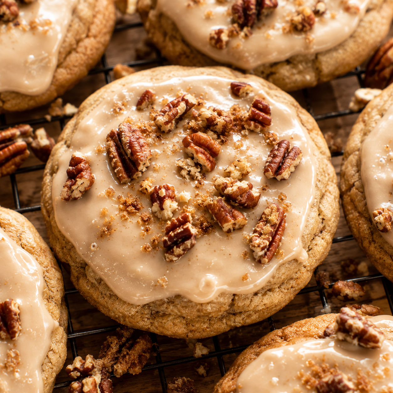 Maple frosted butter pecan cookies with toasted pecans on top