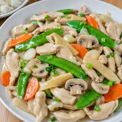 Moo goo gai pan with chicken, mushrooms, snow peas, carrots, and glossy sauce