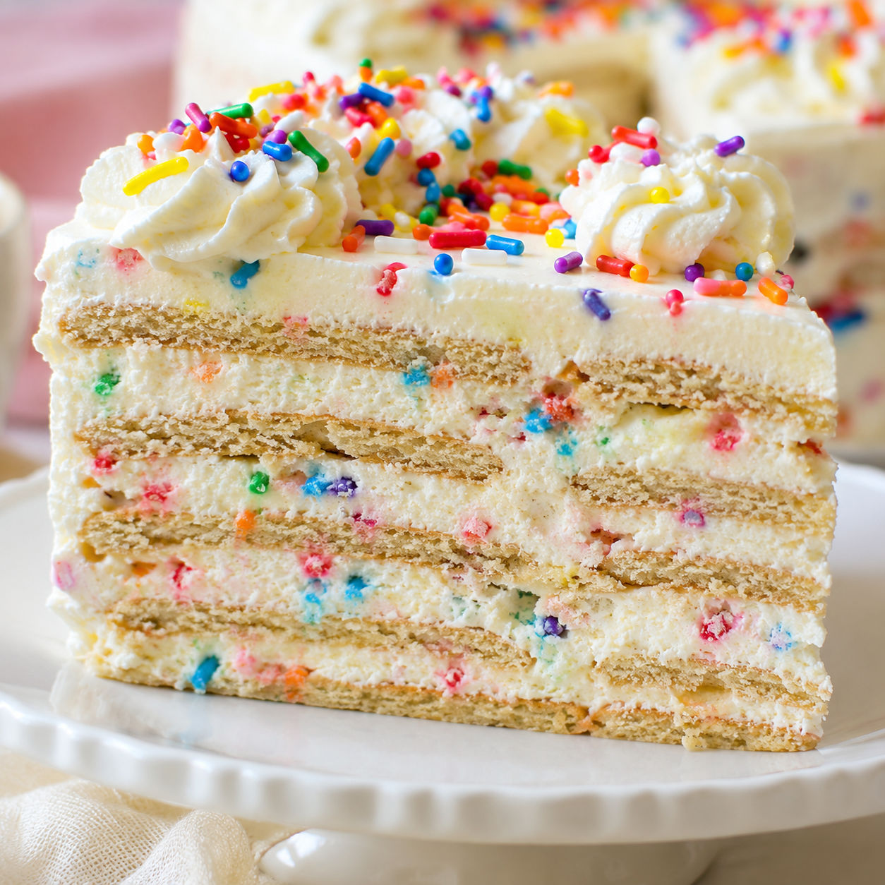 Funfetti Oreo icebox cake slice with sprinkles and cream cheese filling