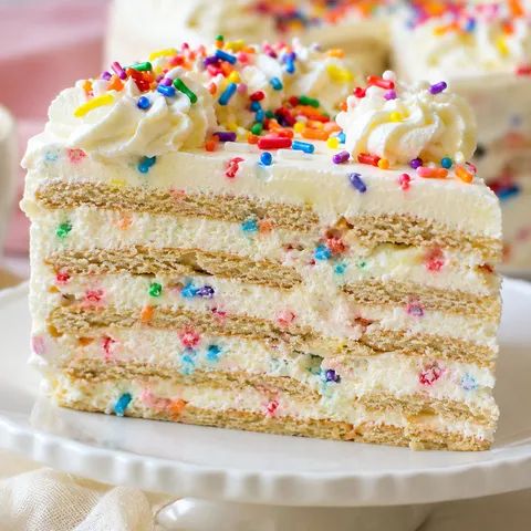 Funfetti Oreo icebox cake slice with sprinkles and cream cheese filling